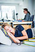 Woman taking a nap in the office