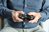 Senior man playing videogames