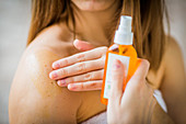 Woman using carrot oil