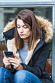 Woman using an Iphone
