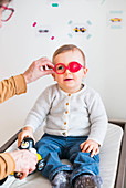Baby having his sight tested
