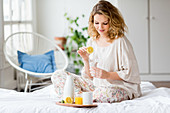 Woman drinking lemon juice