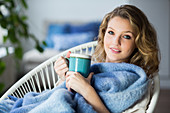 Woman drinking hot beverage