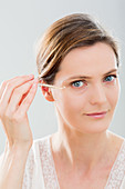 Woman using serum eye contour