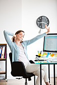 Office woman stretching arms at work