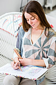 Woman colouring a mandala