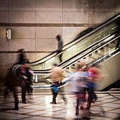 People using escalators
