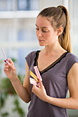 Woman holding oral contraception pills