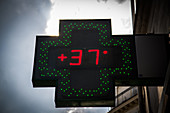 Pharmacy sign indicating outside temperature