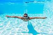 Man swimming in pool