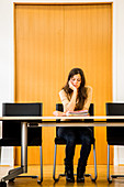 Woman alone in a conference room
