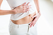 Woman suffering from abdominal pain