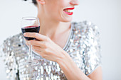 Woman drinking a glass of red wine