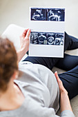 Woman looking at baby scan