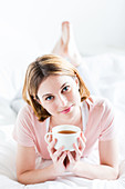 Woman drinking hot beverage