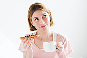 Woman eating a jam sandwich