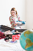 Woman packing a suitcase