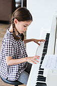 Girl studying piano
