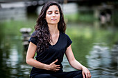 Woman practicing respiratory exercises