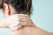 Woman suffering from neck pain