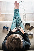 Teenager playing videogames