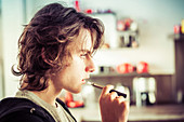 Teenager smoking electronic cigarette