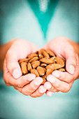 Woman holding almonds