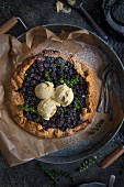 A blueberry galette with ice cream