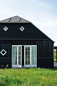 Wooden house with lattice French windows