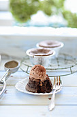 A chocolate muffin with chocolate ice cream