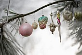 Vintage Christmas-tree decorations on frosty branchy