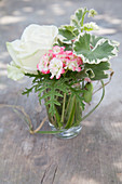 Posy of lemon-scented geraniums and white rose