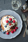 Gluten-free banana pancakes with raspberries and blueberries (vegan)