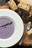 Purple cauliflower soup served with rusks (South Africa)
