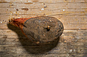 A leg of farmhouse ham on a wooden background