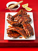 Pork ribs with BBQ sauce and lemons