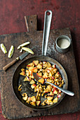 Pan-fried apple and walnuts as a soup topping
