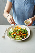 Courgette and carrot salad with rocket, green asparagus and hemp seeds