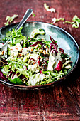 Quick and easy fitness salad with pine nuts and pumpkin seeds