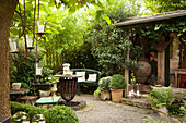 Vintage furniture and potted plants on terrace
