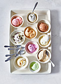 Different flavours of frozen yoghurt in small bowls