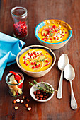 Pumpkin and sweet potatoes cream soup with apples and pomegranate