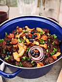 Beef goulash with blueberries and chanterelle mushrooms