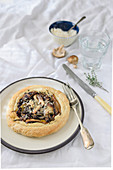 A small mushroom tart with thyme and parmesan