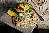 Salmon with a herb and garlic sauce