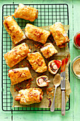 Baked sausages with mushrooms and halloumi cheese wrapped in yeast pastry