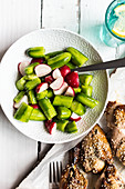 Baked cucumber salad with radishes and sesame chicken