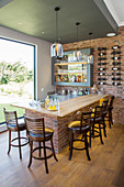 Home bar with rustic brick wall and counter