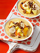 Peach smoothie bowls with bananas and pecans