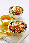 Breakfast bowl with rice, quinoa, vegetables, salmon and halloumi